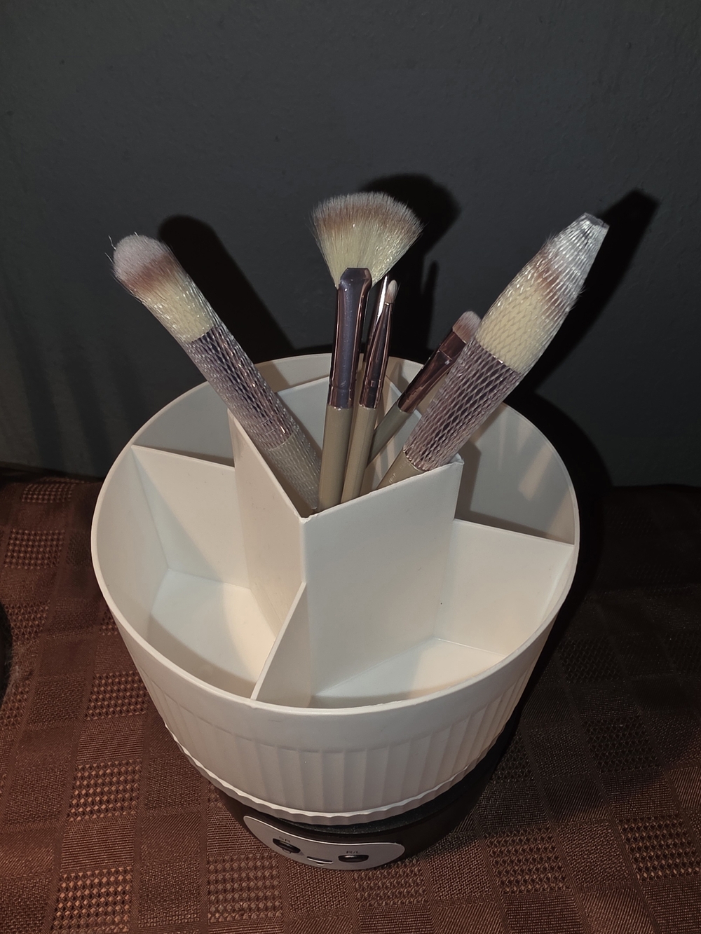 Cream Rotating Makeup Brush Organizer with 6 Brushes.